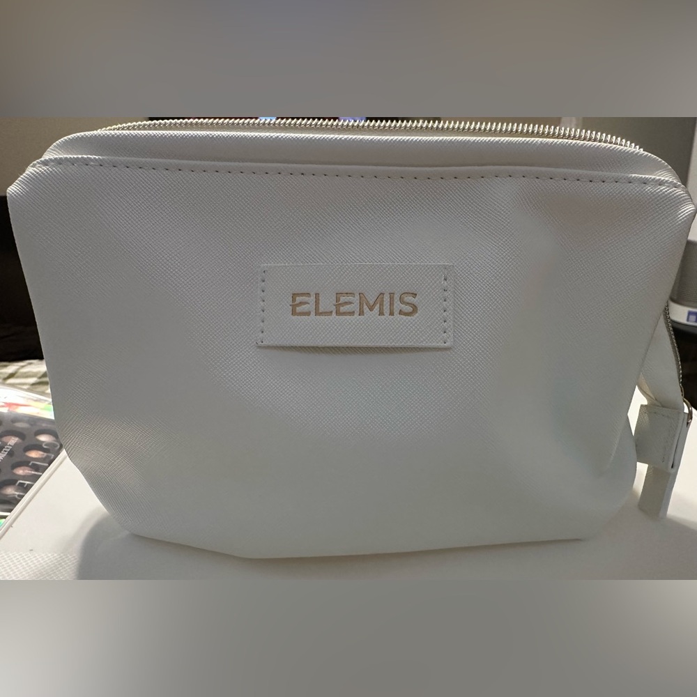 ELEMIS Cream Cosmetic Pouch with Gold Logo and Additional Products - Picture 3 of 6